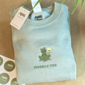 Embroidered green frog with lily flower in the sage sweatshirt and toadally fine word